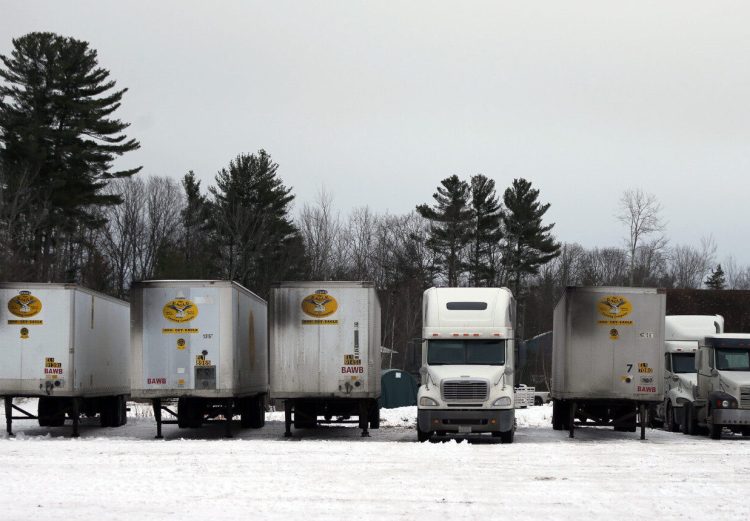State police seized five trucks and trailers owned and operated by Commodity Haulers Express of North Kingston, Rhode Island, which police say owes about $75,000 in unpaid tolls to the Maine Turnpike Authority and faces felony theft-of-services charges.