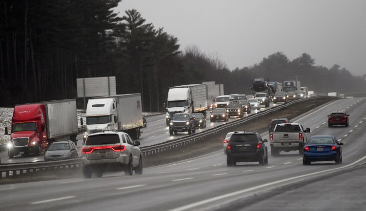 Traffic backed up on the Northbound lane of the Maine Turnpike in Scarborough Friday, Dec. 27, after icy conditions caused several crashes.
