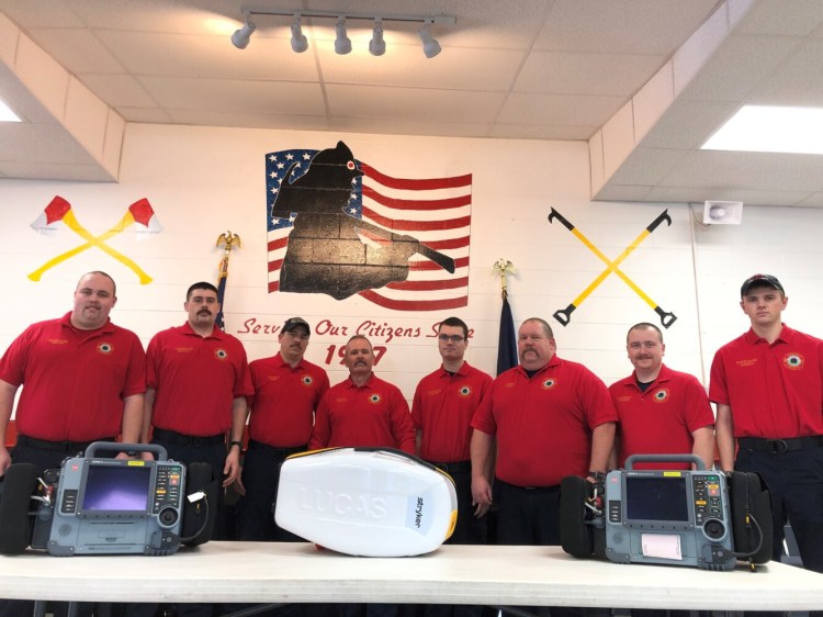 Winslow firefighters who are Advanced EMTs or are in the process of becoming Advanced EMTS. From left, Cameron Aucoin, Cormick Frizzell, Capt. Waylon Capp, Chief Ronnie Rodriguez, Sam Solmitz, Lt. Jeff Reny, Lt. Adam Burgess and Connor Osborne. They are pictured with two cardiac monitors and a mechanical CPR device the department received through a regional grant. 