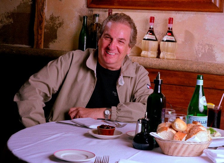 In this July 28, 2001 file photo, Danny Aiello poses for a photo at Gigino restaurant in New York. Aiello, the blue-collar character actor whose long career playing tough guys included roles in “Fort Apache, the Bronx,”  "The Godfather, Part II," “Once Upon a Time in America” and his Oscar-nominated performance as a pizza man in Spike Lee’s "Do the Right Thing," has died. 