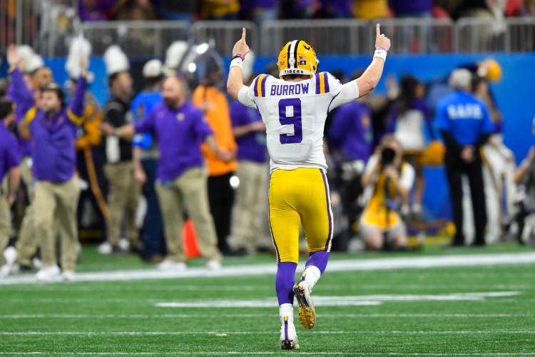 LSU quarterback Joe Burrow celebrates a touchdown against Oklahoma during the first half of the College Football Playoff semifinal on Saturday in Atlanta. 