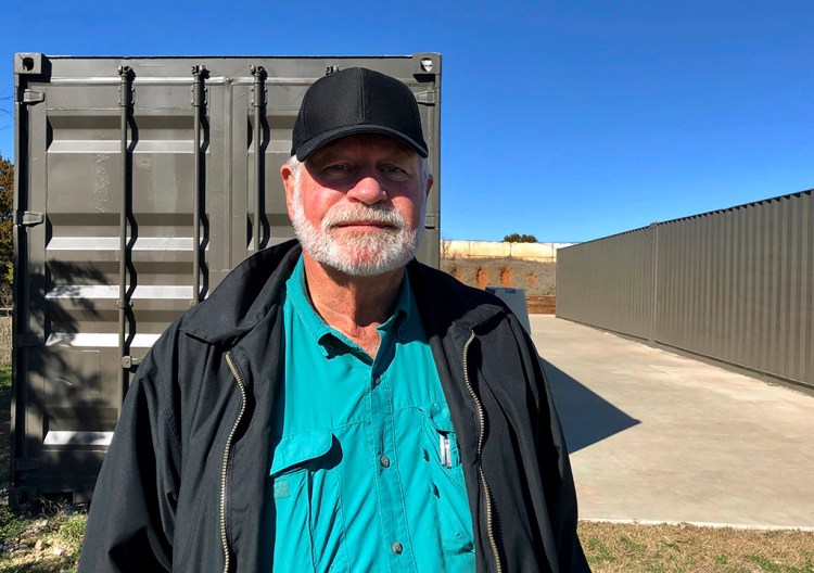Jack Wilson, 71, poses at the firing range outside his home in Granbury, Texas, on Monday. Wilson trains the volunteer security team of the West Freeway Church of Christ, where a gunman shot two people Sunday before being shot by Wilson.
