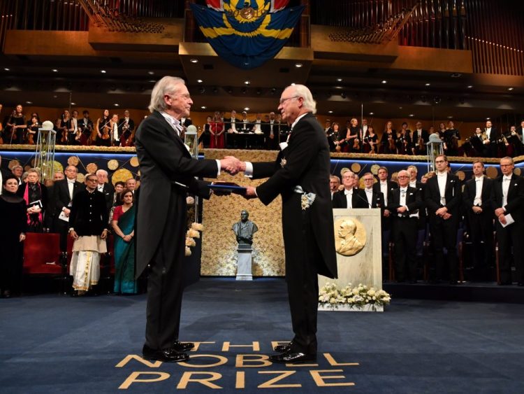 Austrian author Peter Handke, left, receives the 2019 Nobel Prize from King Carl Gustaf of Sweden, during the Nobel Prize award ceremony at the Stockholm Concert Hall, in Stockholm, Tuesday, Dec. 10, 2019. 