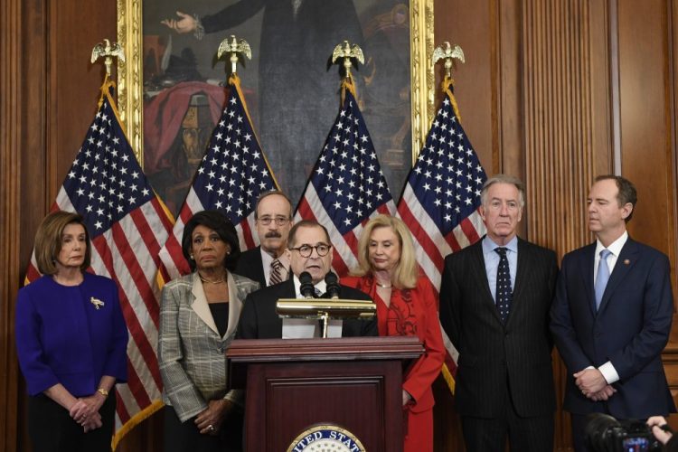From left House Speaker Nancy Pelosi, Chairwoman of the House Financial Services Committee Maxine Waters, D-Calif., Chairman of the House Foreign Affairs Committee Eliot Engel, D-N.Y., House Judiciary Committee Chairman Jerrold Nadler, D-N.Y., Chairwoman of the House Committee on Oversight and Reform Carolyn Maloney, D-N.Y., House Ways and Means Chairman Richard Neal and Chairman of the House Permanent Select Committee on Intelligence Adam Schiff, D-Calif., unveil articles of impeachment against President Donald Trump, during a news conference on Capitol Hill in Washington, Tuesday, Dec. 10, 2019.(AP Photo/Susan Walsh)