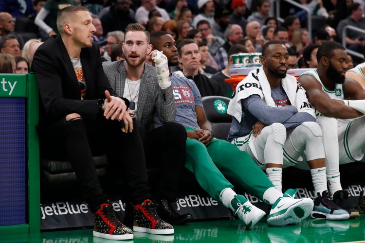 Boston's Gordon Hayward, second from left, will return to practice on Sunday and hopes to be back in the Celtics' lineup before Christmas. He has been out since breaking his left hand on Nov. 9.
