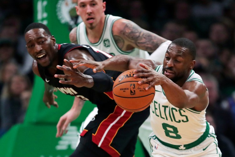 Boston guard Kemba Walker steals the ball from Miami center Bam Adebayo during Wednesday's game in Boston.