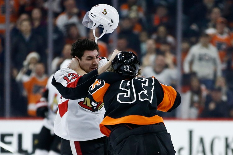 Ottawa’s Nick Paul, left, and Philadelphia’s Jakub Voracek fight during the first period of the Flyers’ 4-3 win Saturday in Philadelphia.