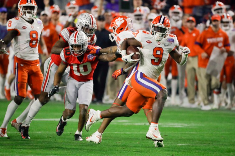 Clemson running back Travis Etienne runs for a touchdown against Ohio State during the second half Tigers' 29-23 win over Ohio State in the College Football Playoff semifinal on Saturday in Glendale, Arizona.
