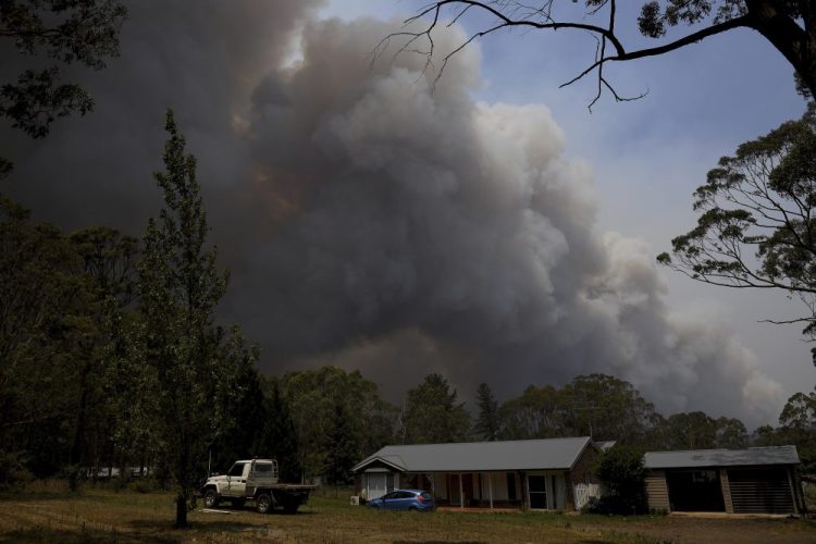 Smoke from the Grose Valley fire rises in the distance in Sydney on Saturday. 