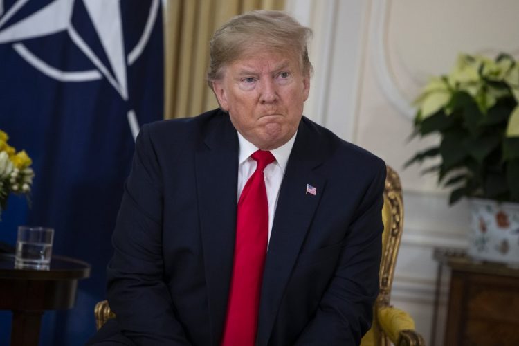 U.S. President Donald Trump speaks during a meeting with NATO Secretary General, Jens Stoltenberg at Winfield House in London, Tuesday, Dec. 3, 2019. US President Donald Trump will join other NATO heads of state at Buckingham Palace in London on Tuesday to mark the NATO Alliance's 70th birthday. (AP Photo/Evan Vucci)