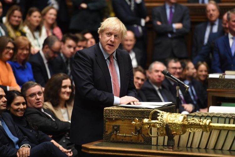 In this photo released by the House of Commons, Britain's Prime Minister Boris Johnson speaks to the house on the first day of the new Parliament, in London, Tuesday, Dec. 17, 2019. Buoyed by a big new Conservative majority in Parliament, Johnson toughened his Brexit stance on Tuesday, ruling out any extension of an end-of-2020 deadline to strike a trade deal with the European Union. (Jessica Taylor/House of Commons via AP)