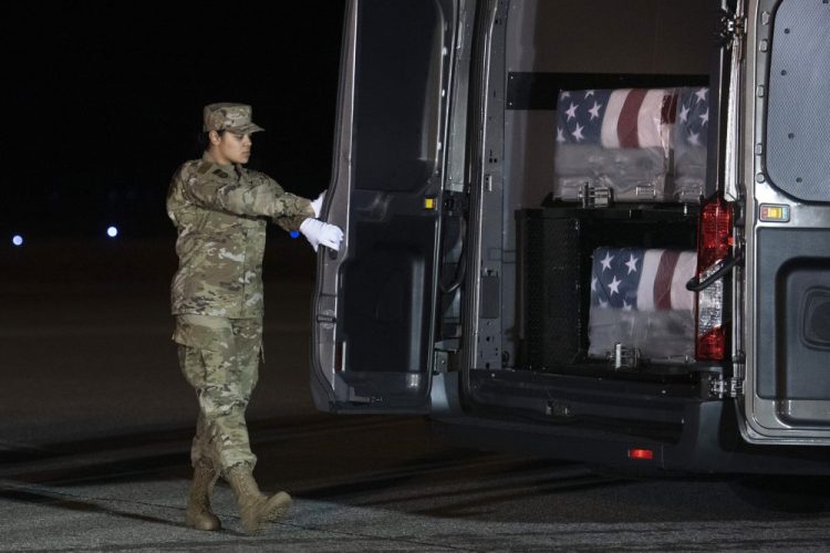 Air Force Door Attendant Staff Sgt. Siannie Conception closes the door of the transfer vehicle carrying the transfer cases containing the remains of Ensign Cameron Joshua Kaleb Watson, Seaman Mohammed Sameh Haitham and Seaman Apprentice Cameron Scott Walters, Sunday, Dec. 8, 2019, at Dover Air Force Base, Del. A Saudi gunman killed the three in a shooting at Naval Air Station Pensacola in Florida. 