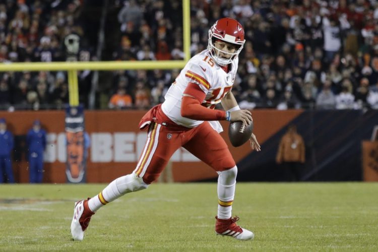 Kansas City quarterback Patrick Mahomes runs for a 12-yard touchdown against the Bears in the first half. 