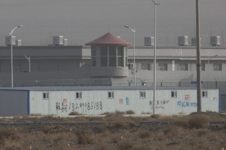 A guard tower and barbed wire fences are seen around a facility in the Kunshan Industrial Park in Artux in western China's Xinjiang region. According to people in contact with government employees, the Xinjiang government is deleting data, destroying documents, tightening controls on information and has held high-level meetings in response to leaks of classified papers on its mass detention camps for Uighurs and other predominantly Muslim minorities. 