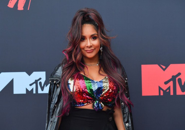 Reality TV personality Nicole "Snooki" Polizzi arrives at the 2019 MTV Video Music Awards on Aug. 26. The "Jersey Shore" star says she's quitting the show.