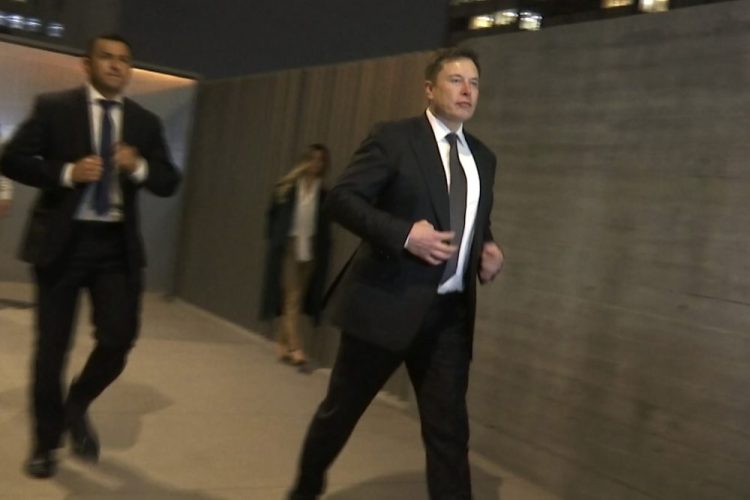 Tesla CEO Elon Musk leaves court on Tuesday in Los Angeles. Musk denied that he meant to call a British cave diver a pedophile when he dubbed him "pedo guy" on social media. 