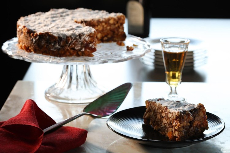 Panforte is a traditional Italian sweet, said to be invented in Siena, filled with nuts, dried fruits and spices. A glass of vin santo (which means holy wine) makes a beautiful companion. 