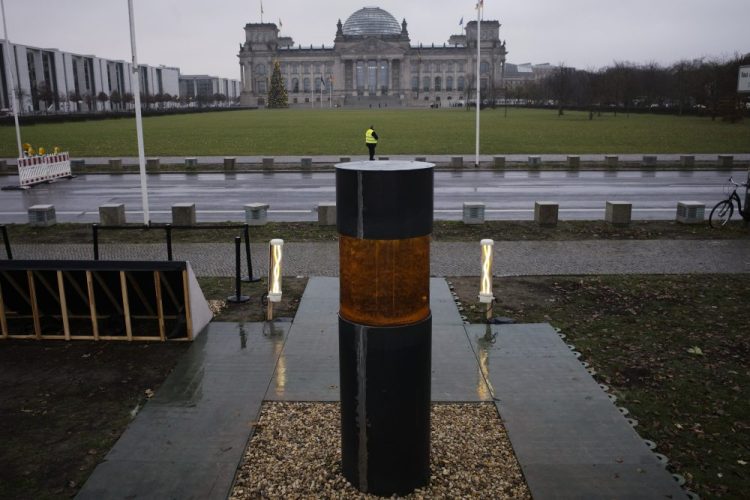 The artist group "Center for Political Beauty" placed an urn containing the remains of Holocaust victims in front of German parliament building, the Reichstag, in Berlin, Germany. Markus Schreiber via AP