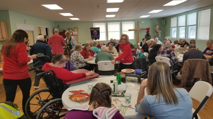 The Knights of Columbus Council 2392 held a festive event for the older citizens of the Moose River Valley with their December luncheon. In attendance were 48 people who enjoyed a ham dinner, a visit from Santa, festive music and lots of gifts.