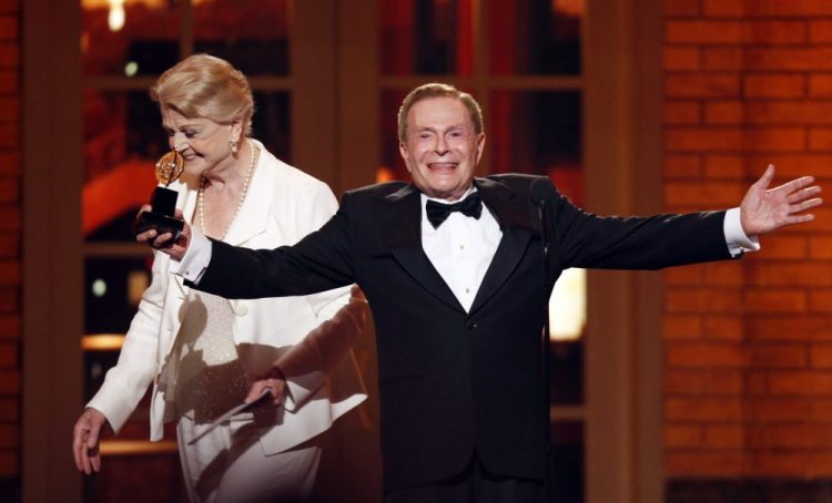 In this June 7, 2009, file photo, Jerry Herman accepts his Special Tony Award for Lifetime Achievement in the Theater from Angela Lansbury at the 63rd Annual Tony Awards in New York. 