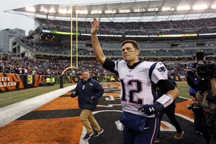 New England Patriots quarterback Tom Brady waves to the crowd afterbeating Cincinnati on Dec. 15.
