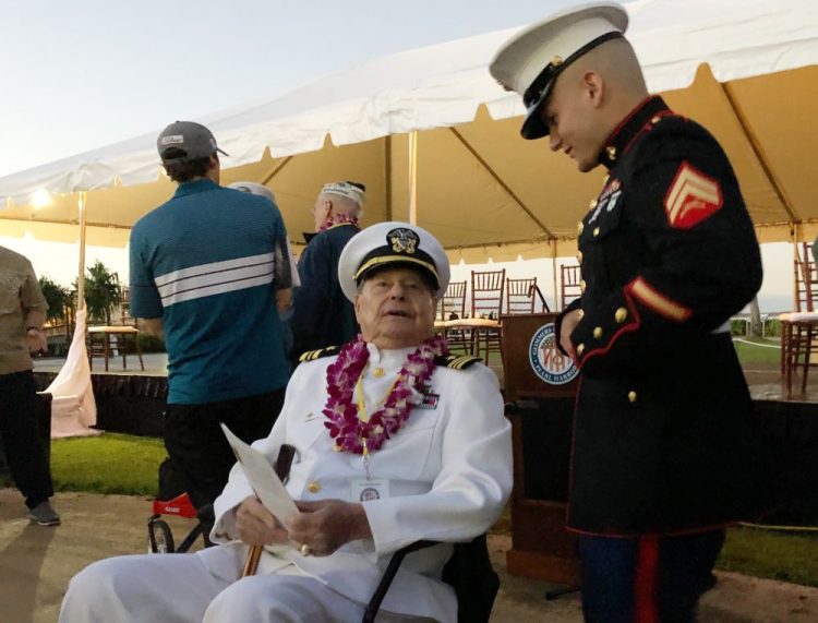 Marine Cpl. Zachariah Jeavons, 22, of Binghamton, N.Y., meets Pearl Harbor survivor Lou Conter, 98, who was aboard the USS Arizona when the Japanese attacked in 1941, Saturday at Pearl Harbor, Hawaii on the 78th anniversary of the attack. 