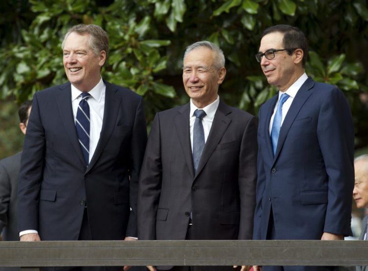 Chinese Vice Premier Liu He accompanied by U.S. Trade Representative Robert Lighthizer, left, and Treasury Secretary Steven Mnuchin, are shown in October. 