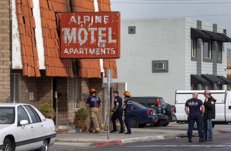 Las Vegas firefighters work the scene of a fire at a three-story apartment complex early Saturday. The fire was in first-floor unit of the Alpine Motel Apartments and its cause was under investigation, the department said.  Authorities say multiple fatalities were reported and several were injured. 