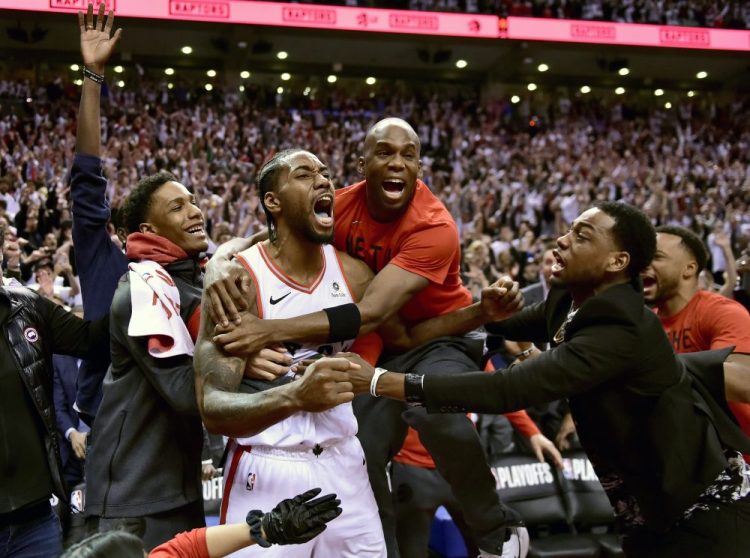 Kawhi Leonard, second from left, did it all last season for the Toronto Raptors, including a crazy shot to win Game 7 of the Eastern Conference semifinals against the Philadelphia 76ers. His big season earned his AP male athlete of the year honors. 