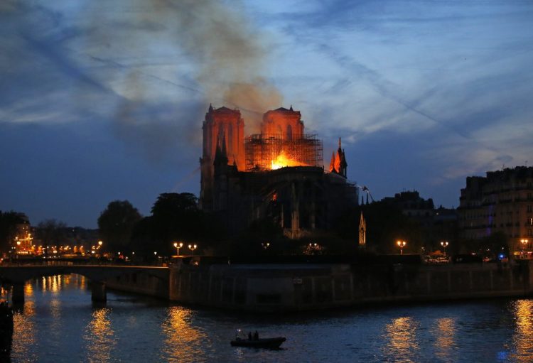 Flames and smoke rise from Notre Dame in Paris as firefighters tackle the blaze on April 15.