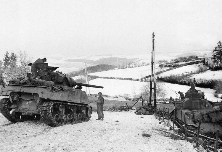 American tanks wait on the snowy slopes in Bastogne, Belgium, on Jan. 6, 1945. It was 75 years ago that Hitler launched his last desperate attack to turn the tide for Germany in World War II.