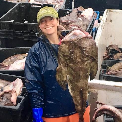 Steph Sykes shows off a monkfish she caught off Cape Cod. The Maine Coast Fishermen's Association is promoting monkfish as an underappreciated fish species, encourgiong people to eat more of the mildly flavored and abundant fish.