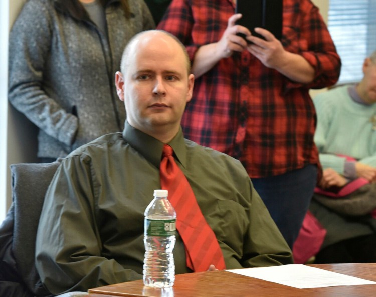 Jackman Town Manager Thomas Kawczynski awaits the announcement by selectmen during a meeting attended by 50-town residents on January 23, 2018. 
