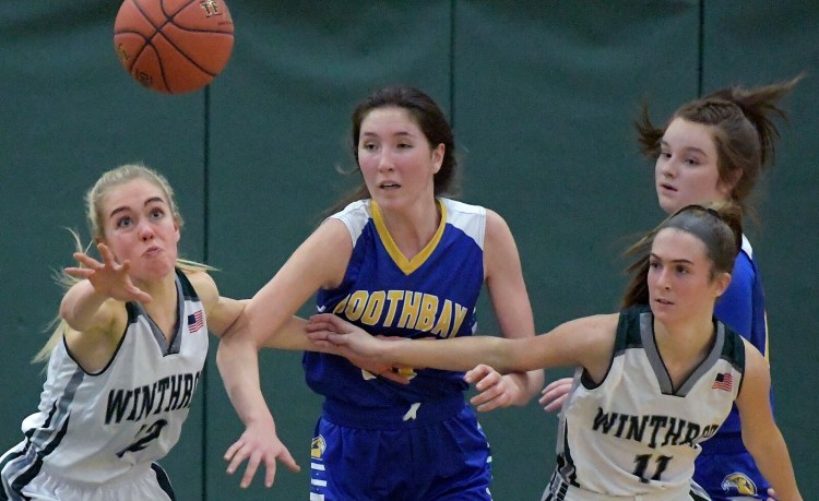 Winthrop's Natalie Frost, left, and Jillian Schmelzer pursue the ball with Boothbay's Madison Forgue on Wednesday in Winthrop.