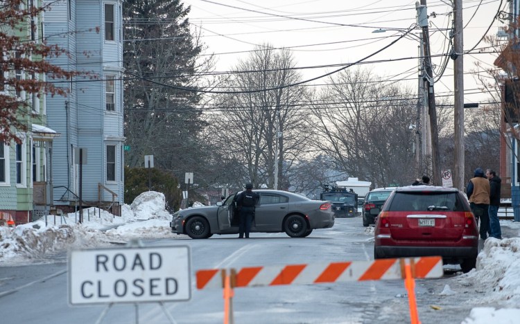 Dozens of local and state police units surrounded 21 Walnut St. in Lewiston early Saturday morning during a standoff. Three people were arrested Sunday in connection with the incident.