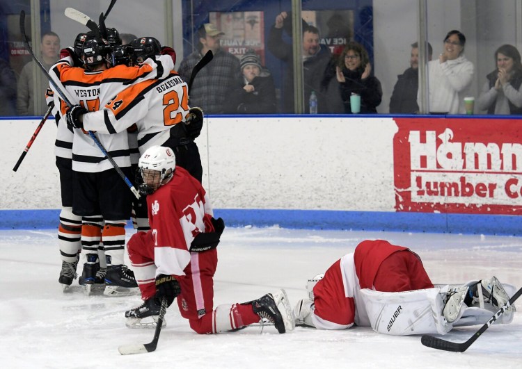 Cony High School's defense reacts to a goal by Gardiner Area High School during a hockey game on Thursday  in Hallowell.