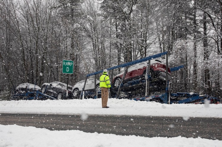 A tractor-trailer carrying cars went off the road on a ramp near Interstate 295 in South Portland during the snowstorm Thursday.