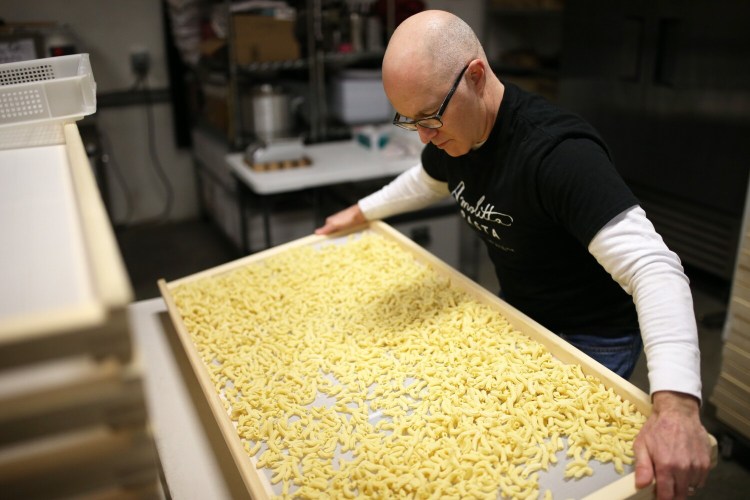 Andrew Steinberg, owner of new Portland-based business Amolitta Pasta prepares fresh torchietti for drying. The number of food and drink entrepreneurs in Maine continues to grow at a steady clip. 