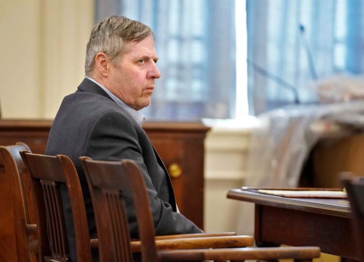 Bruce Akers sits in York County Superior Court in Alfred at the start of his trial on Monday. Akers is charged with murder in connection with the death of his neighbor Douglas Flint in Limington in 2016.