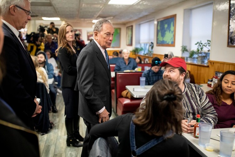 Presidential candidate Mike Bloomberg has a quick chat with patrons at Becky's Diner in Portland during a campaign visit to Maine on Monday.