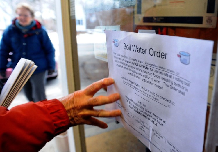 Patrons of the East Vassalboro post office are informed of a boil water order that was displayed on the door Tuesday.