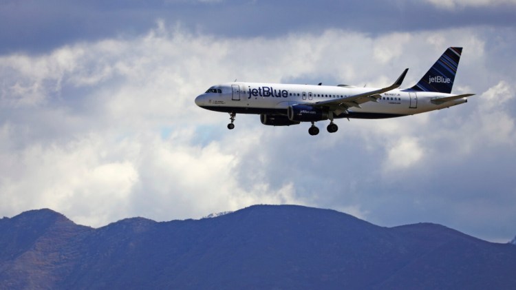 An JetBlue Airways flight flies in to Salt Lake City International Airport on Oct. 18 in Salt Lake City.