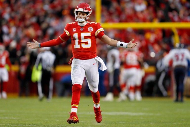 Kansas City quarterback Patrick Mahomes celebrates after throwing a touchdown pass during the second half of the Chiefs' 51-31 win over the Houston Texans in the AFC divisional round on Sunday in Kansas City, Mo.