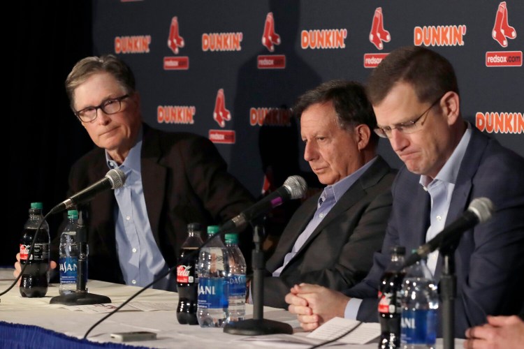 From left, Boston Red Sox owner John Henry, chairman Tom Werner and CEO Sam Kennedy hold a news conference at Fenway Park on Wednesday. The Boston Red Sox parted ways with manager Alex Cora one day after baseball Commissioner Rob Manfred named him as a ringleader with Houston in the sport's sign-stealing scandal.