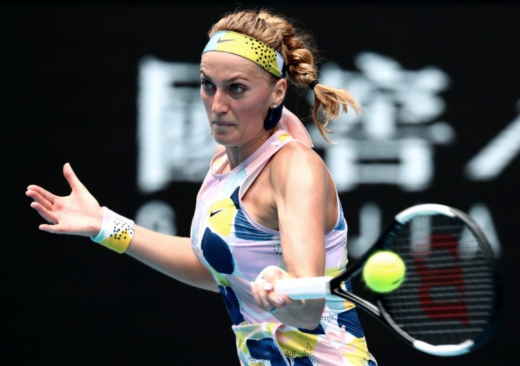 Petra Kvitova of the Czech Republic makes a forehand return to Spain's Paula Badosa during their second round singles match at the Australian Open tennis championship in Melbourne, Australia, Wednesday. 