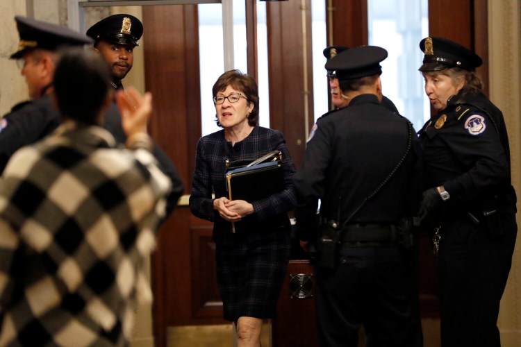 Sen. Susan Collins, R-Maine, arrives at the Capitol on Thursday for the impeachment trial of President Trump.
