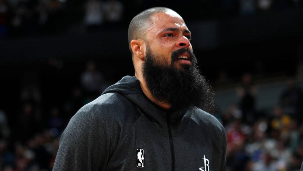 Houston Rockets center Tyson Chandler cries during a tribute to Kobe Bryant before an NBA basketball game against the Denver Nuggets, Sunday, Jan. 26, 2020, in Denver. Bryant died in a California helicopter crash Sunday. (AP Photo/David Zalubowski)