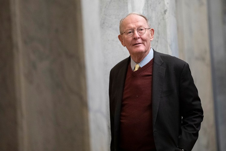 Sen. Lamar Alexander, R-Tenn., arrives on Capitol Hill on Thursday before the impeachment trial of President Trump. He said Thursday night that he would not vote Friday to support calling witnesses in the trial.