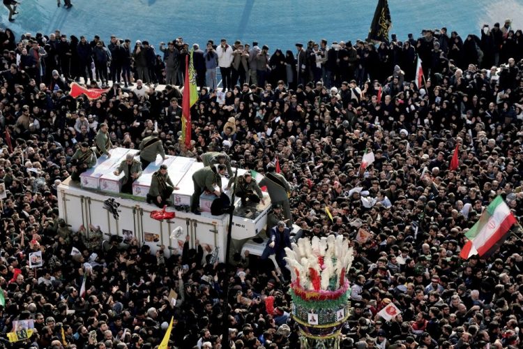 Coffins of Gen. Qassem Soleimani and others who were killed in Iraq by a U.S. drone strike, are carried on a truck surrounded by mourners during a funeral procession at the Enqelab-e-Eslami (Islamic Revolution) square in Tehran, Iran, on Monday. The processions mark the first time Iran honored a single man with a multi-city ceremony. Not even Ayatollah Ruhollah Khomeini, who founded the Islamic Republic, received such a processional with his death in 1989. 