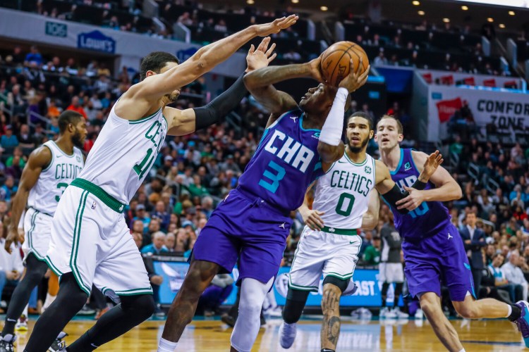 Charlotte's Terry Rozier puts up a shot  over Boston's Enes Kanter during Tuesday's game.  Celtics won 109-92. 
